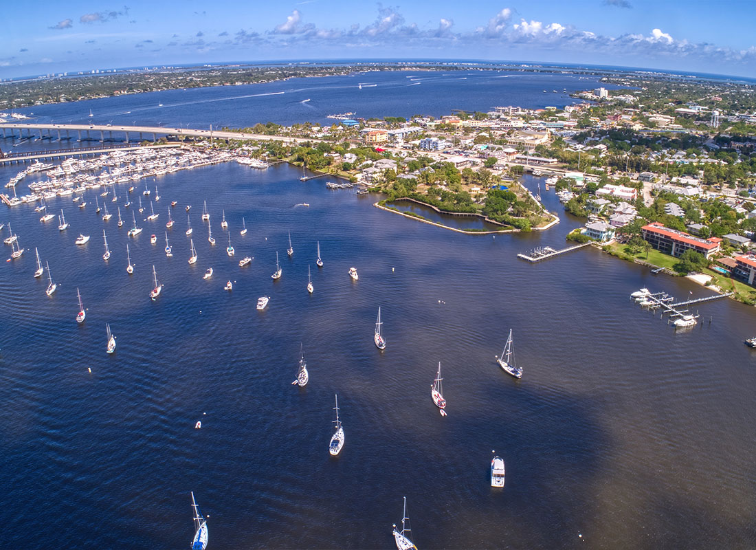 About Our Agency - Aerial View of Stuart in Southern Florida on a Cloudy Day